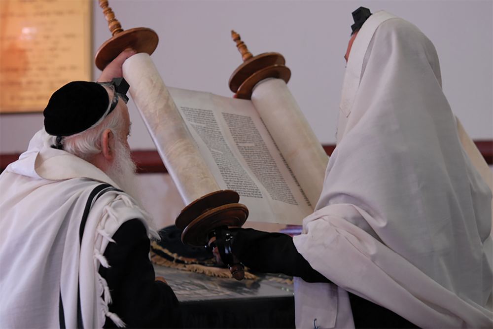 Reading the Torah.