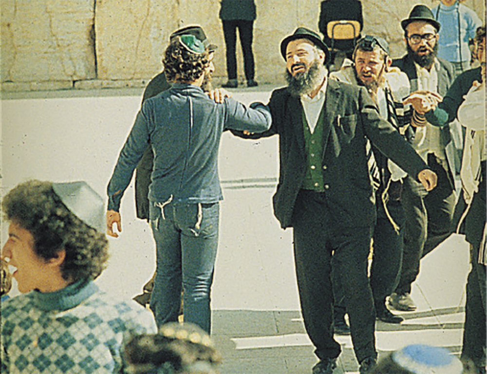 Jewish men dancing during a private ceremony in the Court of the Men at the Western Wall in Jerusalem