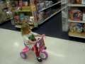 Valerie riding tricycle 