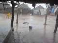 Our hut pounded by rain