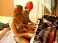 Brother and Sister playing piano 