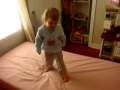 Anna jumping on her bed 