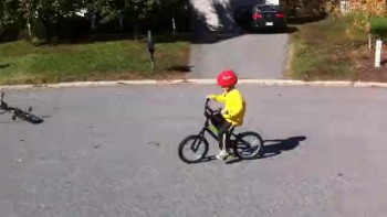 Campbell riding his bike without training wheels 