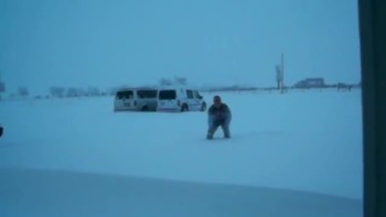 Brent tries to measure the snow at the station 