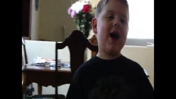 cute boy singing woship song to jesus 