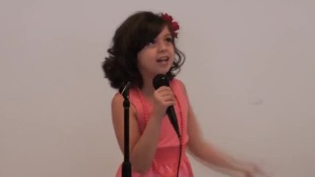 7 year old girl sings and wows over 200 students in alternative school