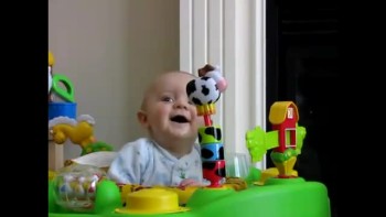 Cute!  Baby laughs at mommy blowing her nose 