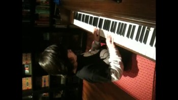 8 yr old writes inspirational song on piano 