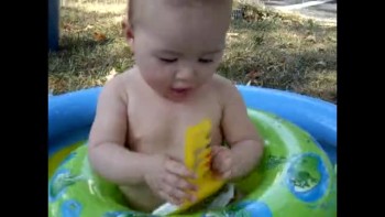 Mayah in her 2 inch pool