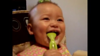 Mayah laughing with spoon 
