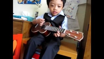 Four Year Old Plays Ukulele & Sings Jesus Loves The Little Children 
