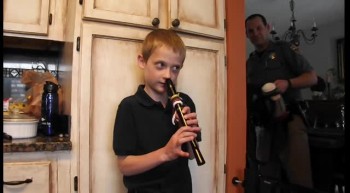 Justin playing recorder with his nose 