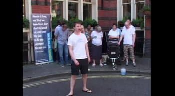 Daniel, a member of the World Vision for Christ Outreach Team, testifying at Petticoat Lane Market in central London. World Vision for Christ have been sharing the Gospel every week, in this location for over 35 years