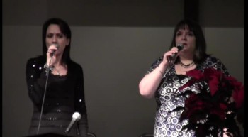 Between lighting the 3rd and 4th Advent candles, two for The One shared "Silent Night" as part of the Christmas Eve Candlelight Service.