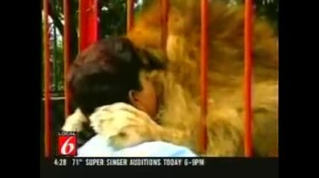 Lion Hugs Rescuer! 