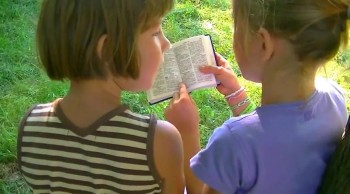 Children enjoy reading the word of God from the Bible 
