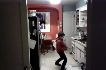 Kid is Caught Doing Something Hilarious (and Cool!) While Washing Dishes 