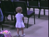 A one and a half year-old girl praises God by dancing to "I Walk By Faith". We could all learn by this. God adores our praises!