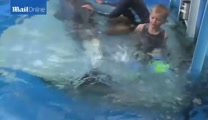 Double Amputee Swims With Disabled Dolphin