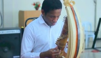 Sasando is a traditional stringed musical instrument from Rote Island, East Nusa Tenggara, Indonesia. Made from a string that is placed on bamboo and covered with palm leaves semicircle. Number of players Sasando still very limited but now this instrument has become more famous and attract many people to learn how to play Sasando. Jesus Loves Me performed by Natalino Mella on the Sasando, an Indonesian version of the harp, Nat plays Sasando 45 Strings