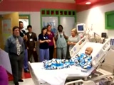 Hospital workers serenade a patient with good news!