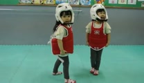 Adorable Chinese toddlers "fight" in their first martial arts competition.