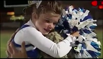 Watch this little cheerleader's eyes when she hears the surprise announcement over the PA!