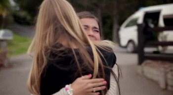 Emotional Meeting of Two Girls Who are Both Missing an Arm