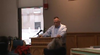 Bruce preaching & singing