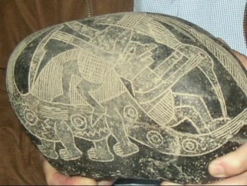 An ancient tribe in Peru buried their dead in pits in the desert, and years later, items have been found in these tombs revealing an advanced civilization.  <br />In many of the tombs, "burial stones" were found upon which   scenes were etched from their daily lives.<br /><br />A private museum in Peru holds more than 10,000 of these stones with about 1/3 of these showing man and dinosaurs interacting with each other.<br /><br />Other scenes on the stones depict blood transfusions, brain surgery, and the use of telescopes and<br />microscopes.<br />This video, produced and narrated by David Babbitt, who has been to Peru, highlights some of these stones through photos. <br /><br />The video also gives a Biblical explanation as to how man and dinosaurs would be found living <br />contemporaneously. It also has a gospel message and is copyright-free for the purpose of sharing the<br />Creation message vs. evolution.  It also has about a one minute video clip of Dennis Swift in Peru explaining a few details about the stones. <br /><br />Dennis is the Christian author of the book, "Secrets of the Ica Stones and Nazca lines," in which he offers his in-depth research into the burial stone discovery.<br /><br />The video also shows some remarkable ancient stonework.<br /><br />Running time 21 minutes.<br /><br />Audio and computer editing by Cathy Friedlander ... Christian videographer, musician, and <br />computer editor authoring over 22 videos and 10 cds. <br /><br />Visit Cathy's website:<br />www.2kingdoms.net<br />