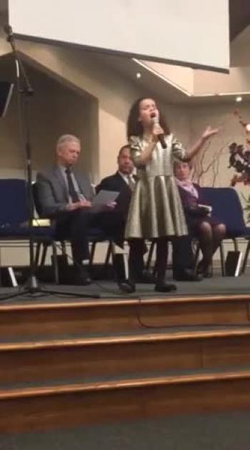 7 year old girl sings powerful song What a Beautiful Name 