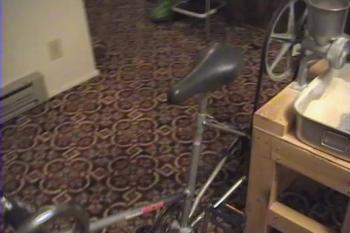 Video demonstration of a homemade exercise bicycle that grinds wheat into flour.