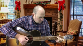 Playing Go Tell It On The Mountain fingertyle on my acoustic guitar. 