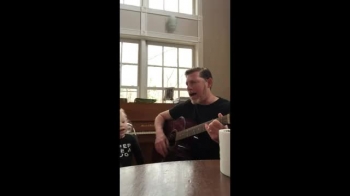 Me singing an old Hank Williams tune at home with my son.