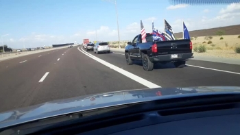 We were on the 303 loop in Surprise Arizona, only to experience a line-up of Patriots Driving  cars and trucks, decorated in TRUMP flags, and American flags, right here in Arizona.