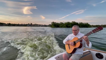I live on a lake in Florida and like to video my music on my boat and my neighbors' boats.  Enjoy!