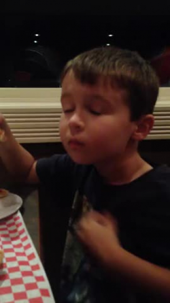 Maybe it's the pizza.  Maybe it's the joy of the Lord.  Either way, watch this kid get so chill into the music!