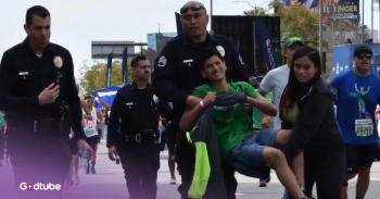 <p>Prepare to be inspired by kindness and support. Watch as a police officer steps in to help a 15-year-old complete a marathon.</p><p><br></p><p>The news report shares how a 15-year-old decided to run an LA marathon alongside 20,000 people. Suddenly, a police officer is shown stepping in to help the boy complete the race. Sergeant Jay from the LAPD was helping with the race and noticed the boy fell down around mile 26. They checked on him, and he was going to be alright. The boy shared that he wanted to finish the race, so the officer and his sister are shown in a clip holding him up, walking arm in arm to assist him in completing the marathon.&nbsp;</p><p><br></p><h2>Teen Runner's Determination Inspires an Officer and His Community</h2><p><br></p><p>The policeman shares in the interview how proud he is of the young man and what he would say to him if he could see him. Sergeant Jay is so inspired that he says he might even run the marathon the next year because of the impact this boy had upon him.&nbsp;</p><p><br></p><p>The boy’s name is revealed as Leobardo. His mother says that they are very proud of him and how grateful they are to those who helped him. It is not easy to complete a marathon at any age, but it is very rare for a 15-year-old to finish this difficult race. Seeing this boy’s determination and stamina reminds us of the abilities and strength that God gives to us and how we can accomplish amazing things with the help of God. Watching this video can remind us of running the race of faith in life alongside other believers who help us along the way. There is such a blessing in Christian community.</p><p><br></p><p><em>“Therefore, since we are surrounded by such a great cloud of witnesses, let us throw off everything that hinders and the sin that so easily entangles. And let us run with perseverance the race marked out for us.” </em><a href="https://www.godtube.com/bible/Hebrews/12-1" rel="noopener noreferrer" target="_blank"><strong><em>Hebrews 12:1</em></strong></a></p><p><br></p><p><strong>YOU MAY ALSO LIKE: </strong><a href="https://www.godtube.com/watch/?v=EJMB1MNU" rel="noopener noreferrer" target="_blank"><strong>She Was Crawling To The Finish Line Until A Kind Stranger Stopped To Help</strong></a></p>