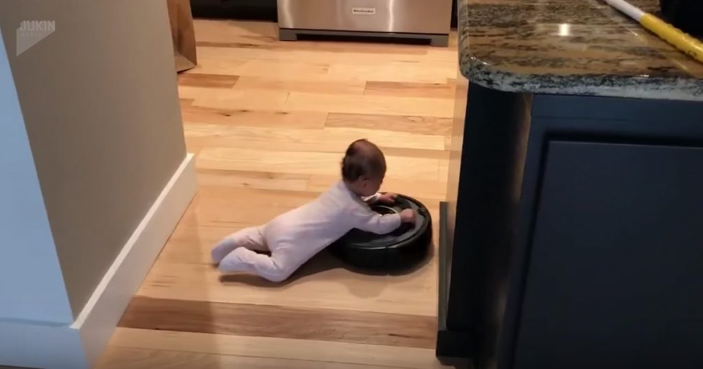 Baby Hilariously Hitches A Ride On A Roomba