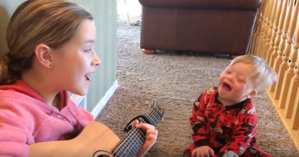 Big Sister Sings 'You Are My Sunshine' To Brother With Down Syndrome