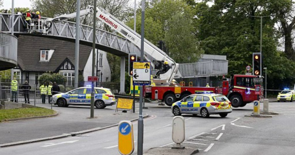 godupdates group of strangers hold suicidal man on bridge 1