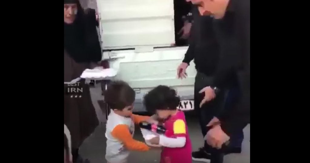 Boy Helps Girl Get Food After Earthquake