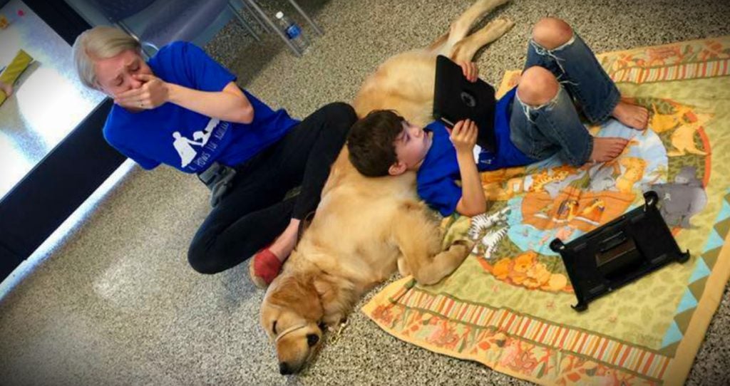 godupdates mom cries when son with autism meets his autism service dog fb