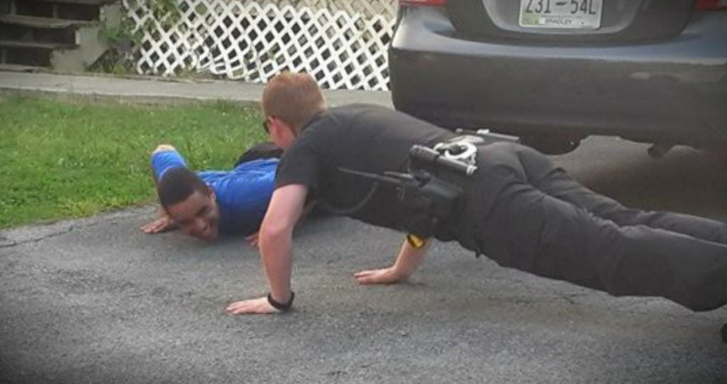 godupdates police officer does push-ups to calm boy with autism fb