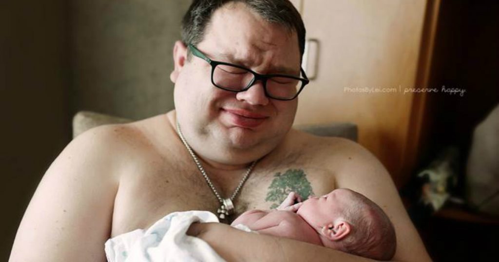 godupdates powerful photo of dad holding his rainbow baby and weeping fb