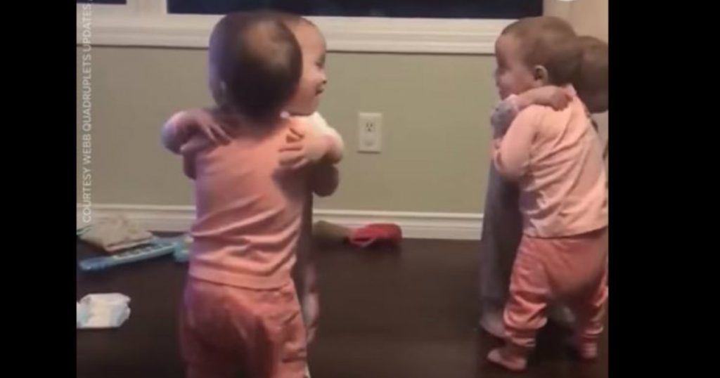 godupdates adorable quadruplets sharing goodnight hugs