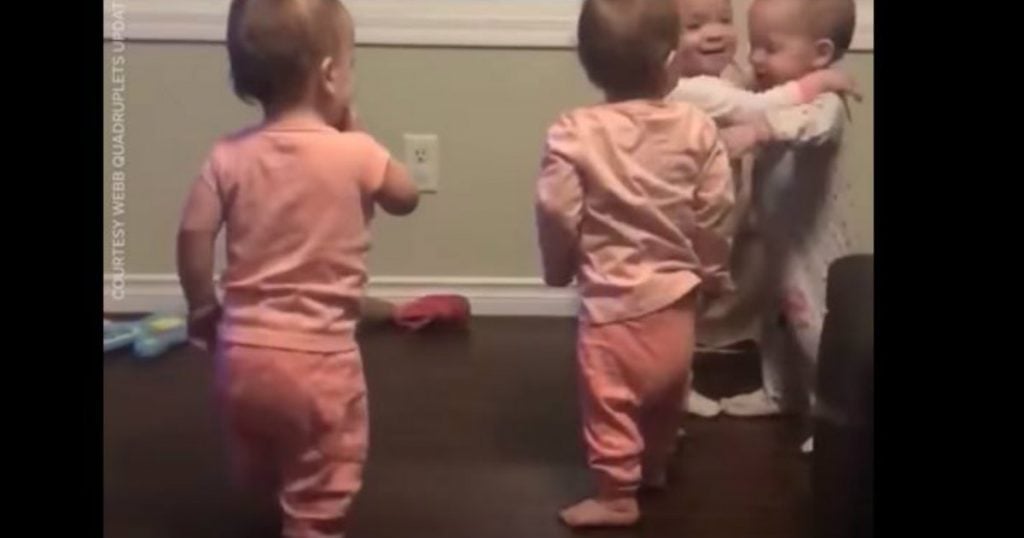 godupdates adorable quadruplets sharing goodnight hugs