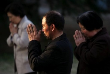 Church members praying. 