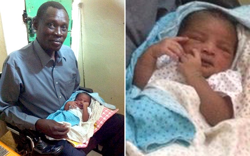 Dad Holds Sudan Baby Born in Prison 