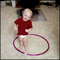 When this baby tries to hula hoop like his big sister, hilarity ensues ...